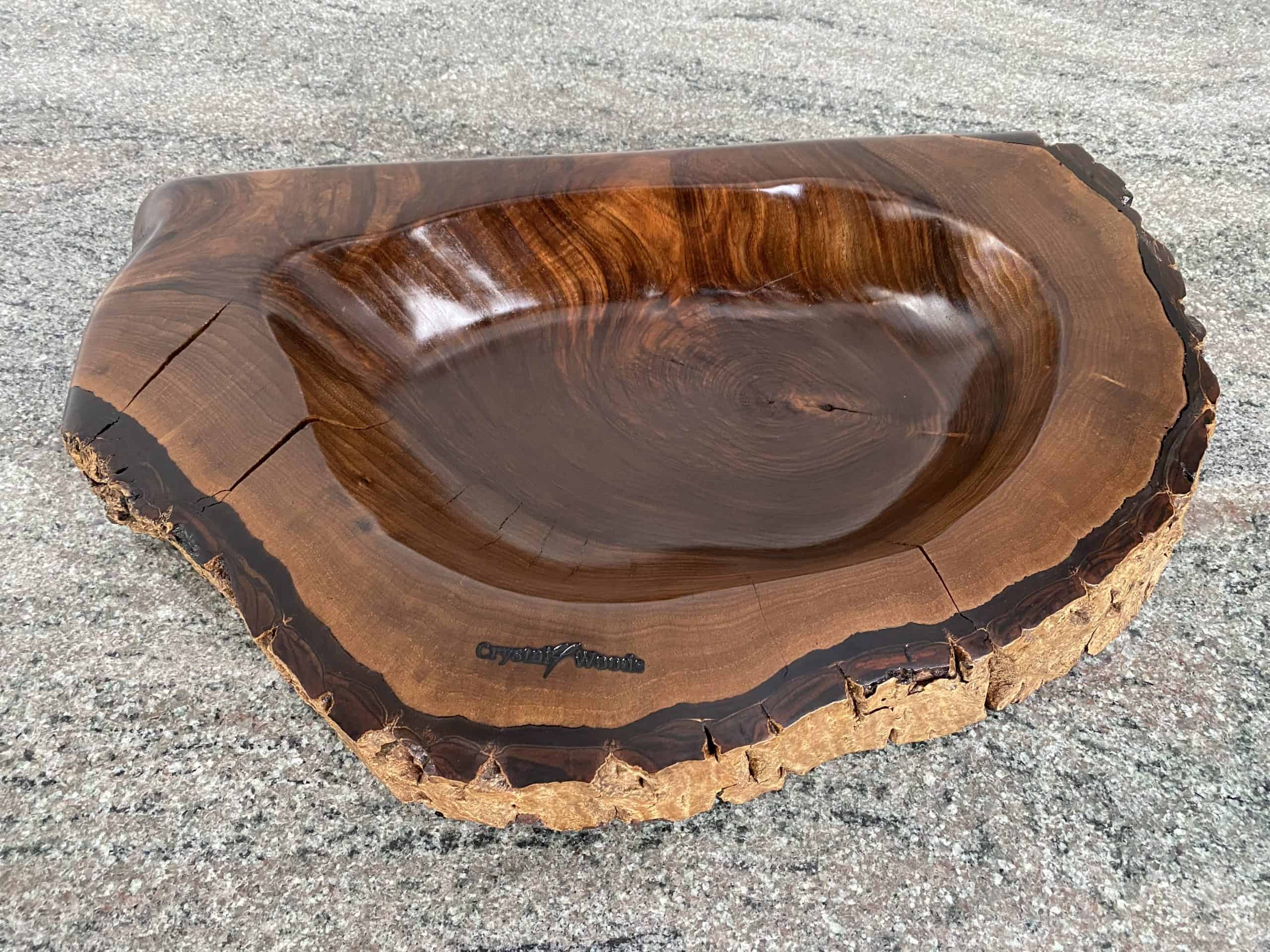 English Walnut Sculptured Reservoir Bowl 5 Over view of Handmade English Walnut Wooden Sculptured Reservoir Bowl with live edge detail, created by Crystal Woods, finished in danish oil, branded with their logo stamp
