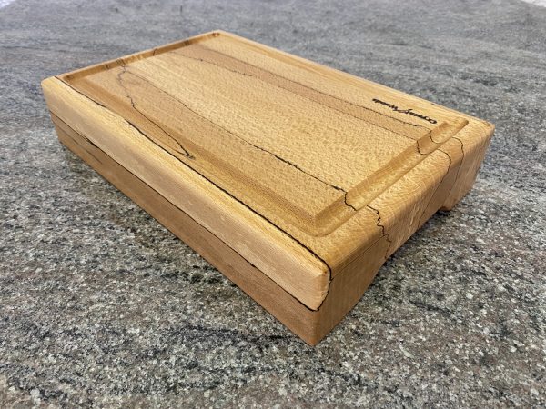 Close up view of this Extra thick Spalted Beech Chopping Board with a Continuous Crumb Groove, handcrafted by Crystal Woods from locally sourced wood in Devon, finished in food safe oil, branded with their logo stamp