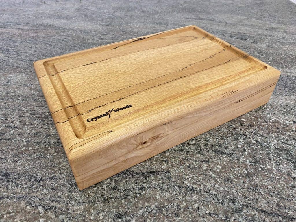 Extra thick Spalted Beech Chopping Board with a Continuous Crumb Groove, handcrafted by Crystal Woods from locally sourced wood in Devon, finished in food safe oil, branded with their logo stamp