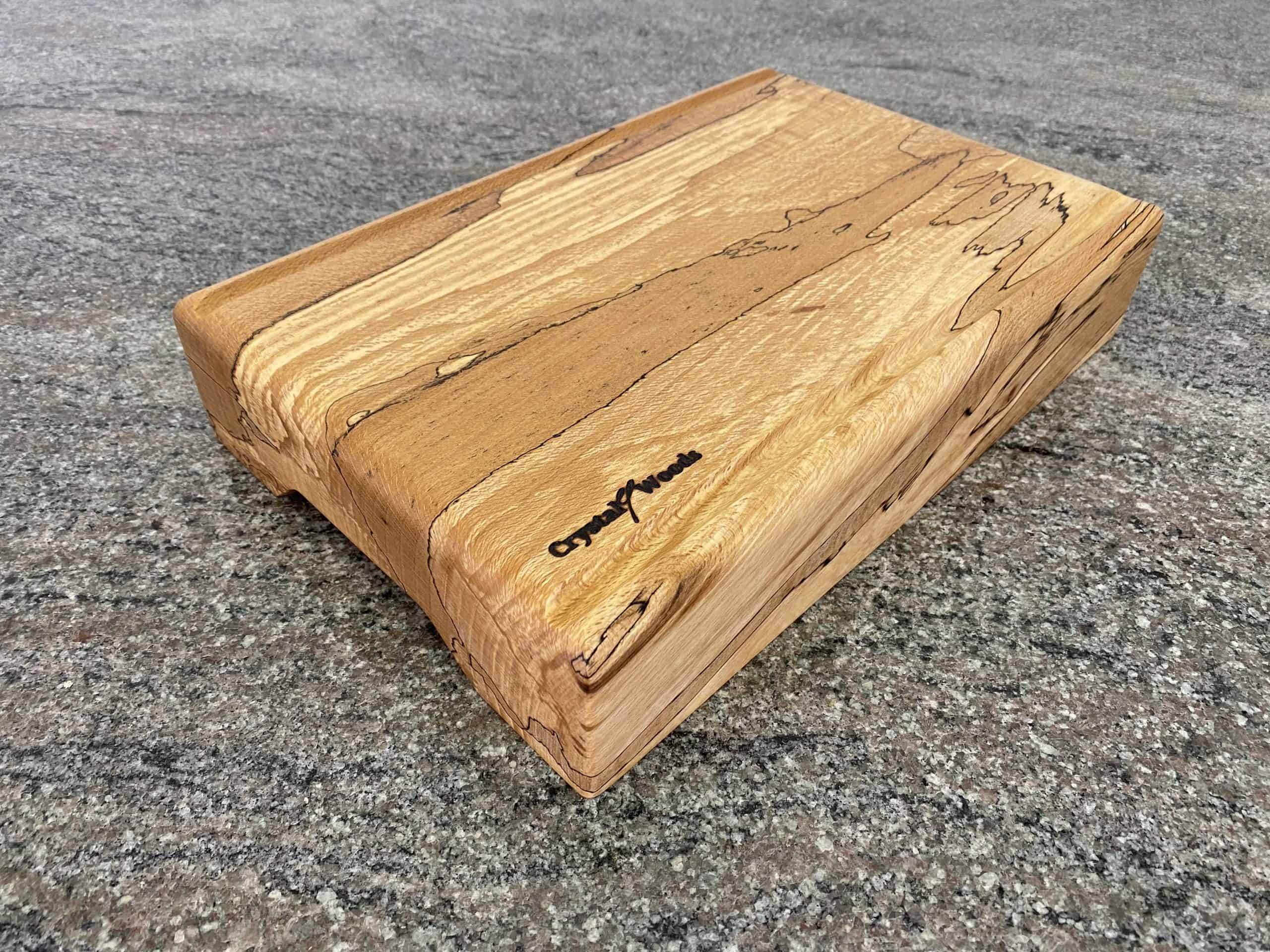 Straight Flute Spalted Beech Chopping Board - Extra Thick 8 Close up over view of this Extra Thick chopping board made from locally sourced English Spalted Beech, with two straight flute crumb grooves, created by Crystal Woods, finished in food safe oil, branded with their logo stamp