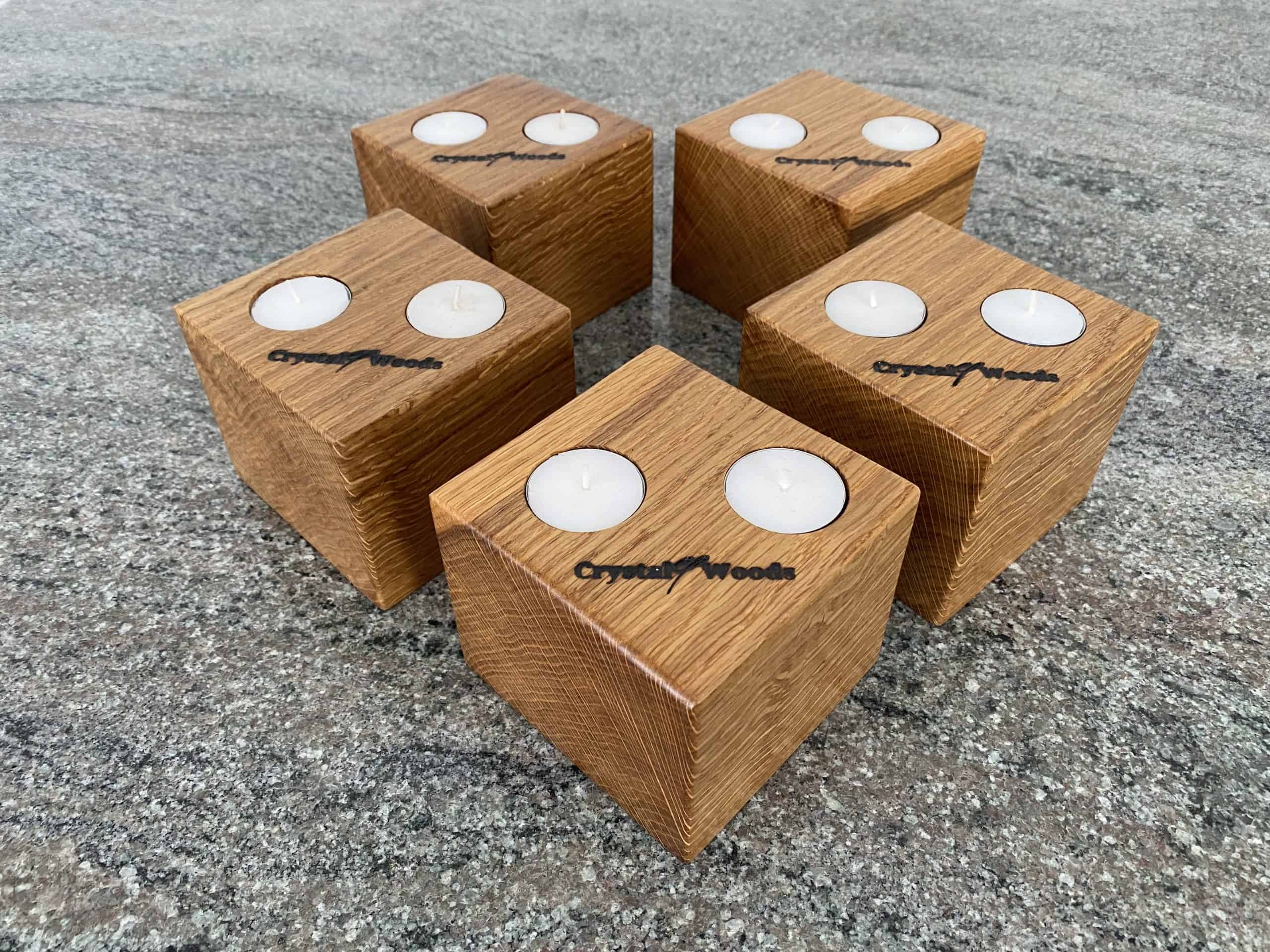 Set of 5 Oak Cubed Block Tea-Light Candle Holders 1 Over view of this Set of 5 Oak Cubed Block Tea-Light Candle Holders, with two tea lights in each, finished in oil, created by Crystal Woods, branded with their logo stamp