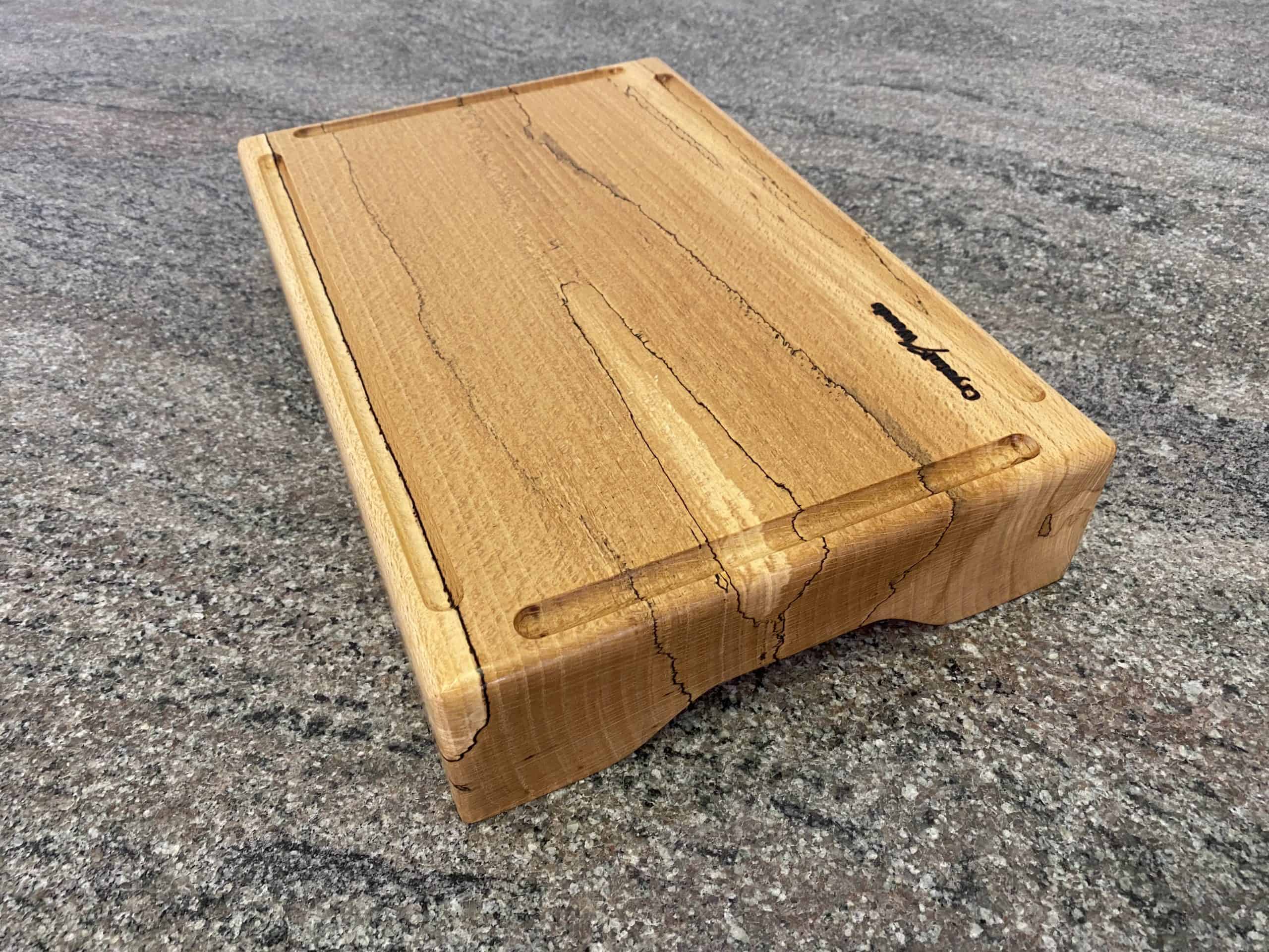 Large Chunky Spalted Beech Chopping Board with 4 Crumb Grooves - Extra Thick 4 Over view of a Large Chunky Spalted Beech Chopping Board with 4 Crumb Grooves – Extra Thick, from locally sourced wood in Devon, finished in food safe oil, handmade by Crystal Woods, branded with their logo stamp