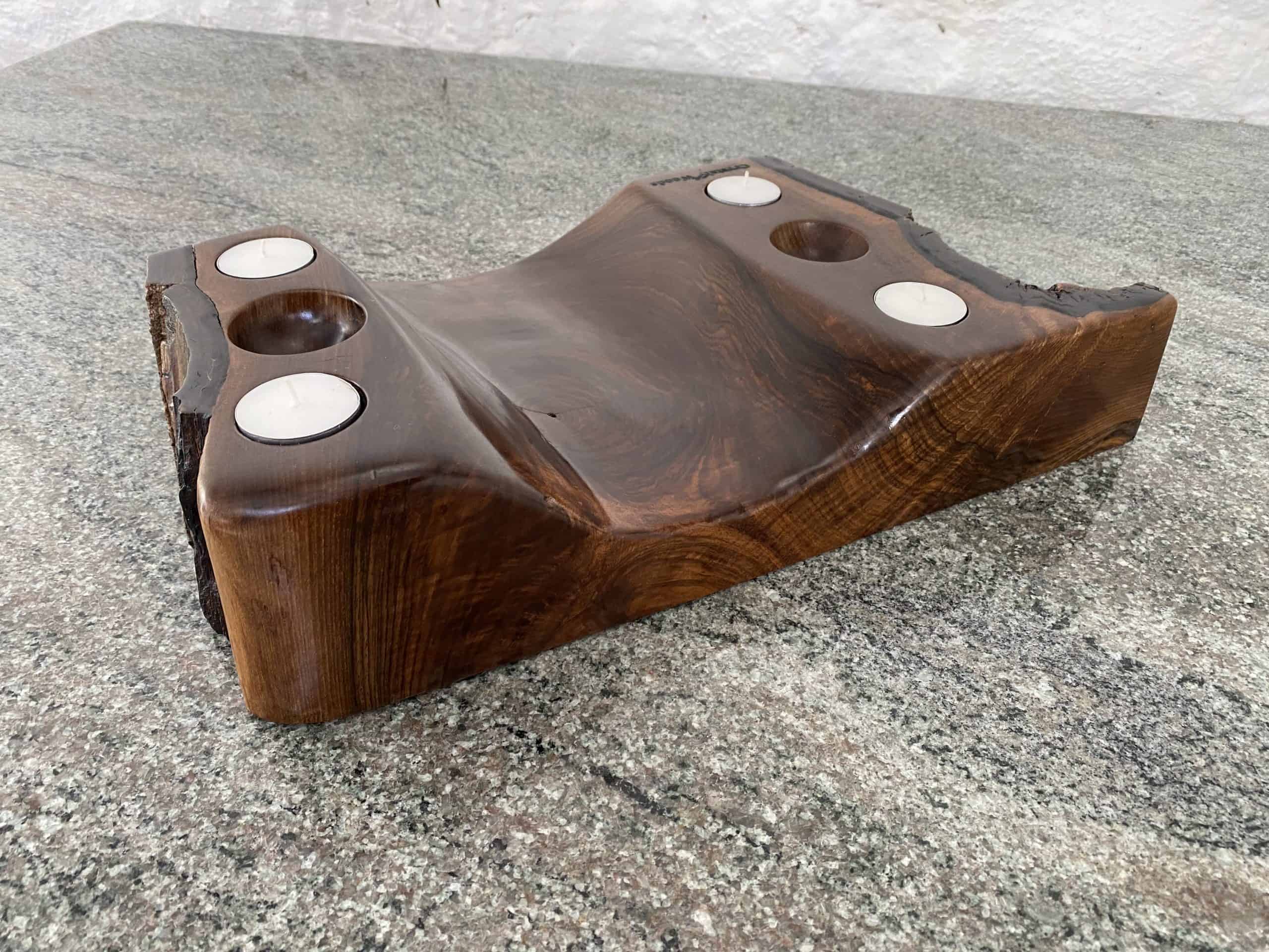 Live Edge Walnut Sculpture Piece 4 Close up view of this English Walnut solid wood Tea Light Holder with 4 small candles and two spherical holes, handcrafted by Crystal Woods with live edge detail, finished to a high patina in oil