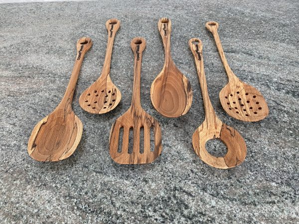 A Luxury Set of 6 Spalted Beech wooden serving spoons, handcrafted by Crystal Woods from locally sourced wood in Devon, finished in food safe oil, branded with their logo stamp