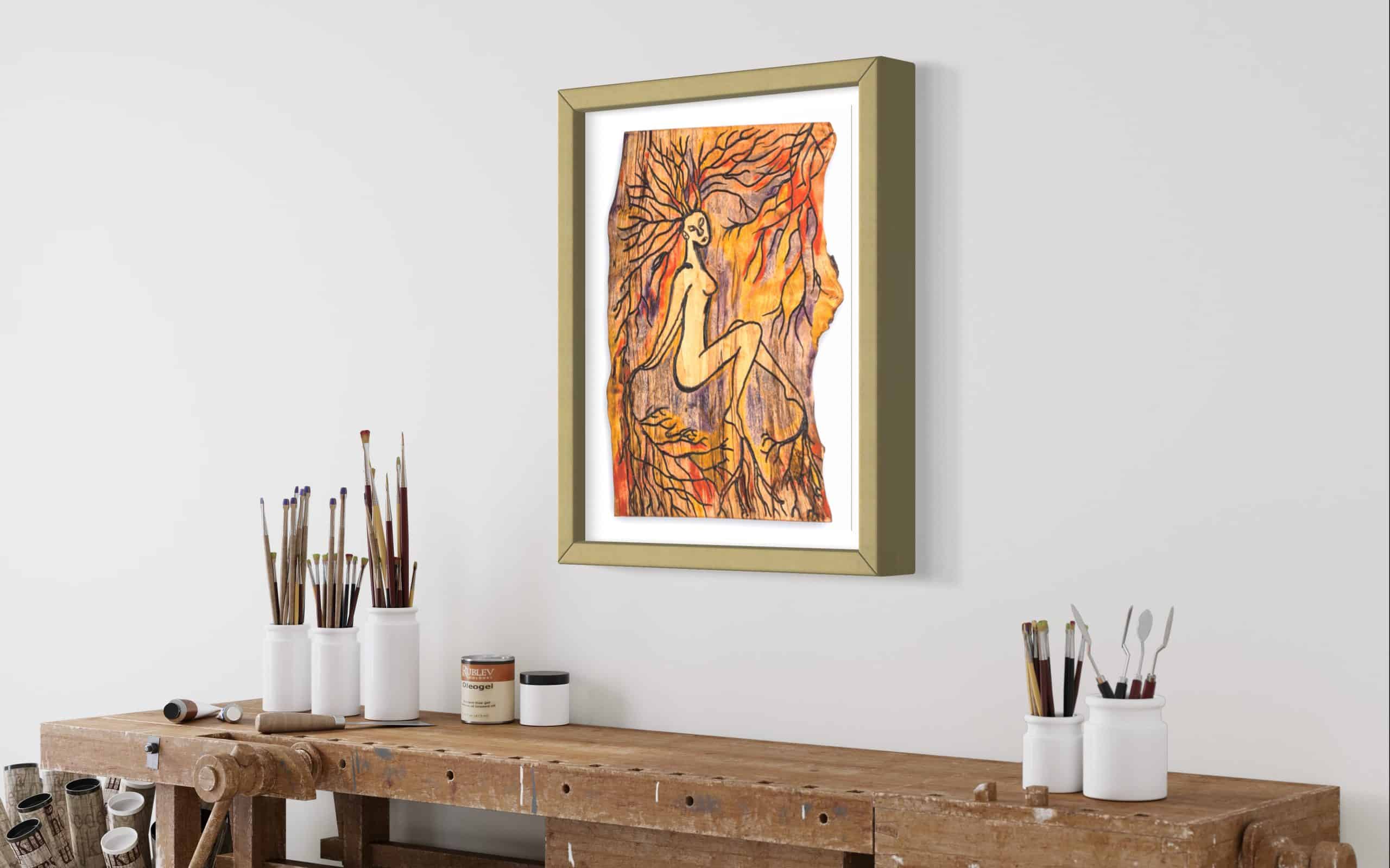 Limited Edition Fine Art Giclee Print - Rooted 5 Right angled side view of this Fine Art Giclee print, limited edition, titled Rooted, illustrated in a olive green frame with a white back on a pale white wall in a room setting, the picture shows a naked female connected to the roots of the forest by her hands, feet and hair