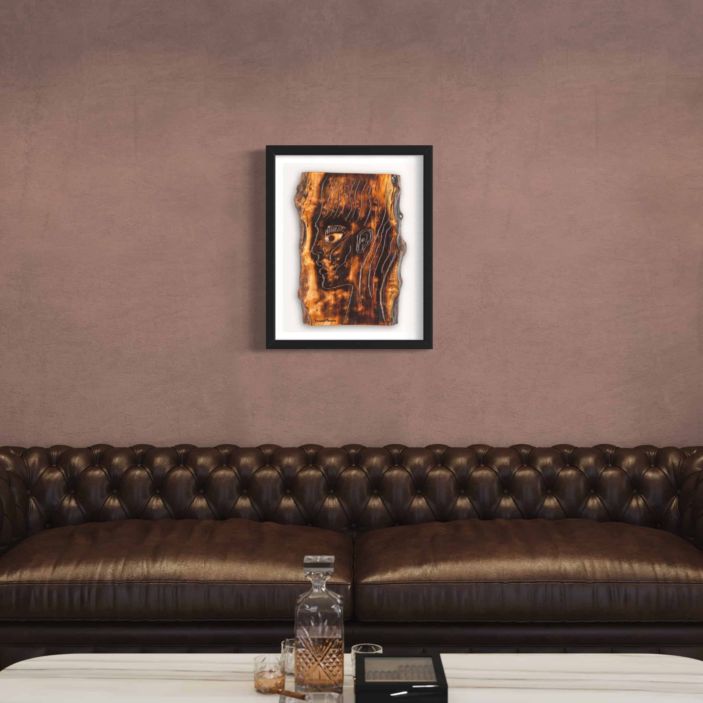 The Energy Inside Me - Limited Edition Fine Art Giclee Print 6 Fine Art Giclee Print of the Original Piece – The Energy Inside Me, a picture of a mans head illustrating the eternal flame of spirituality and the energy that resides within us all, shown in a black frame and a white background set on a pale bronze colour wall above a contemporary leather chesterfield style sofa