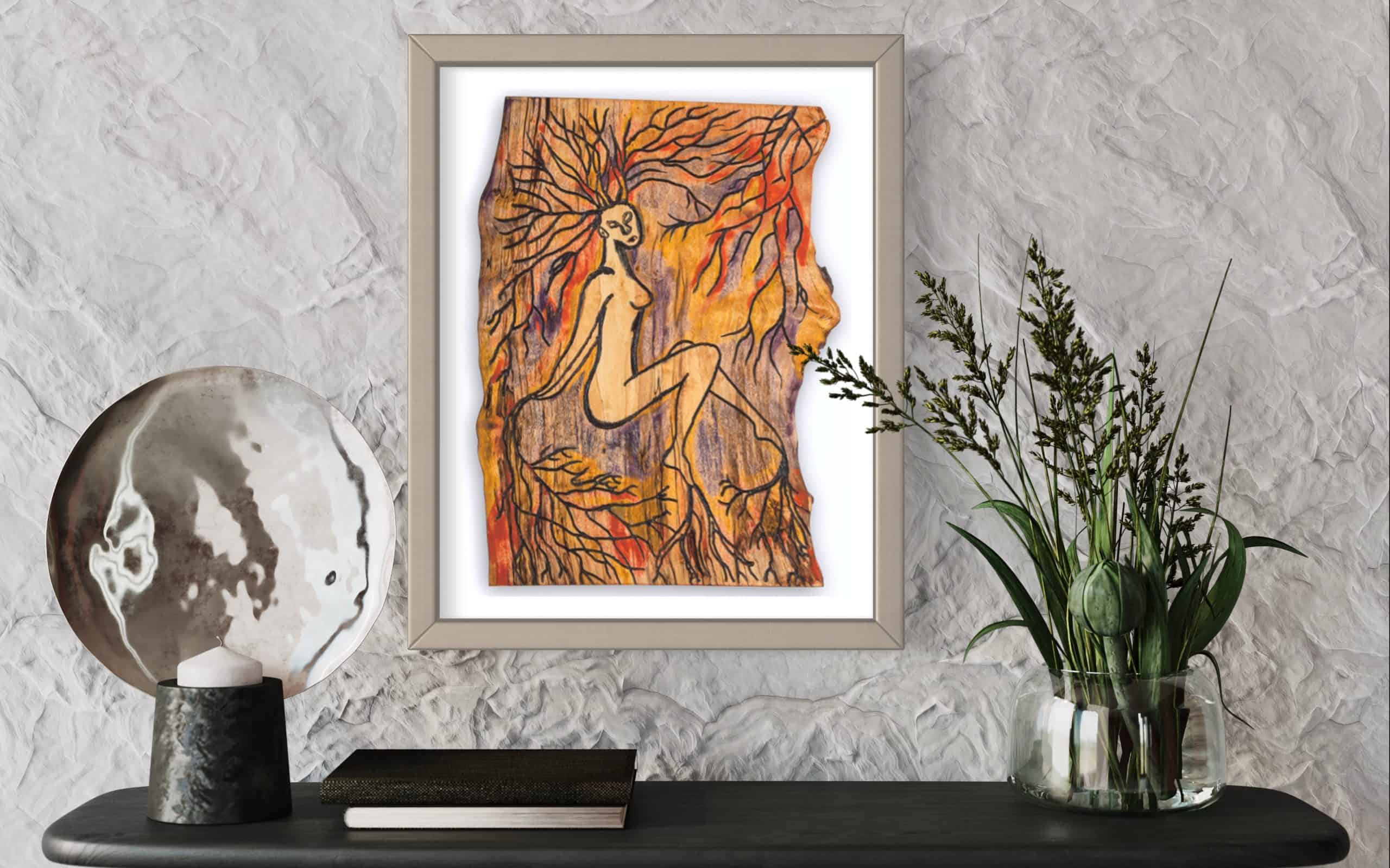 Limited Edition Fine Art Giclee Print - Rooted 6 Close up front on view of this Fine Art Giclee print, limited edition, titled Rooted, illustrated in a silver grey frame with a white back on a textured white wall in a room setting, the picture shows a naked female connected to the roots of the forest by her hands, feet and hair
