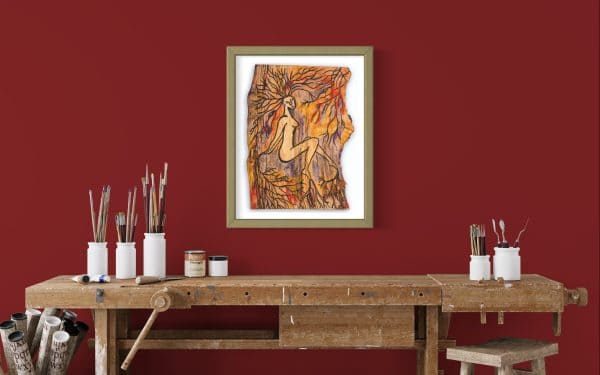 Close up front on view of this Fine Art Giclee print, limited edition, titled Rooted, illustrated in a olive green frame with a white back on a dark red wall in a room setting, the picture shows a naked female connected to the roots of the forest by her hands, feet and hair