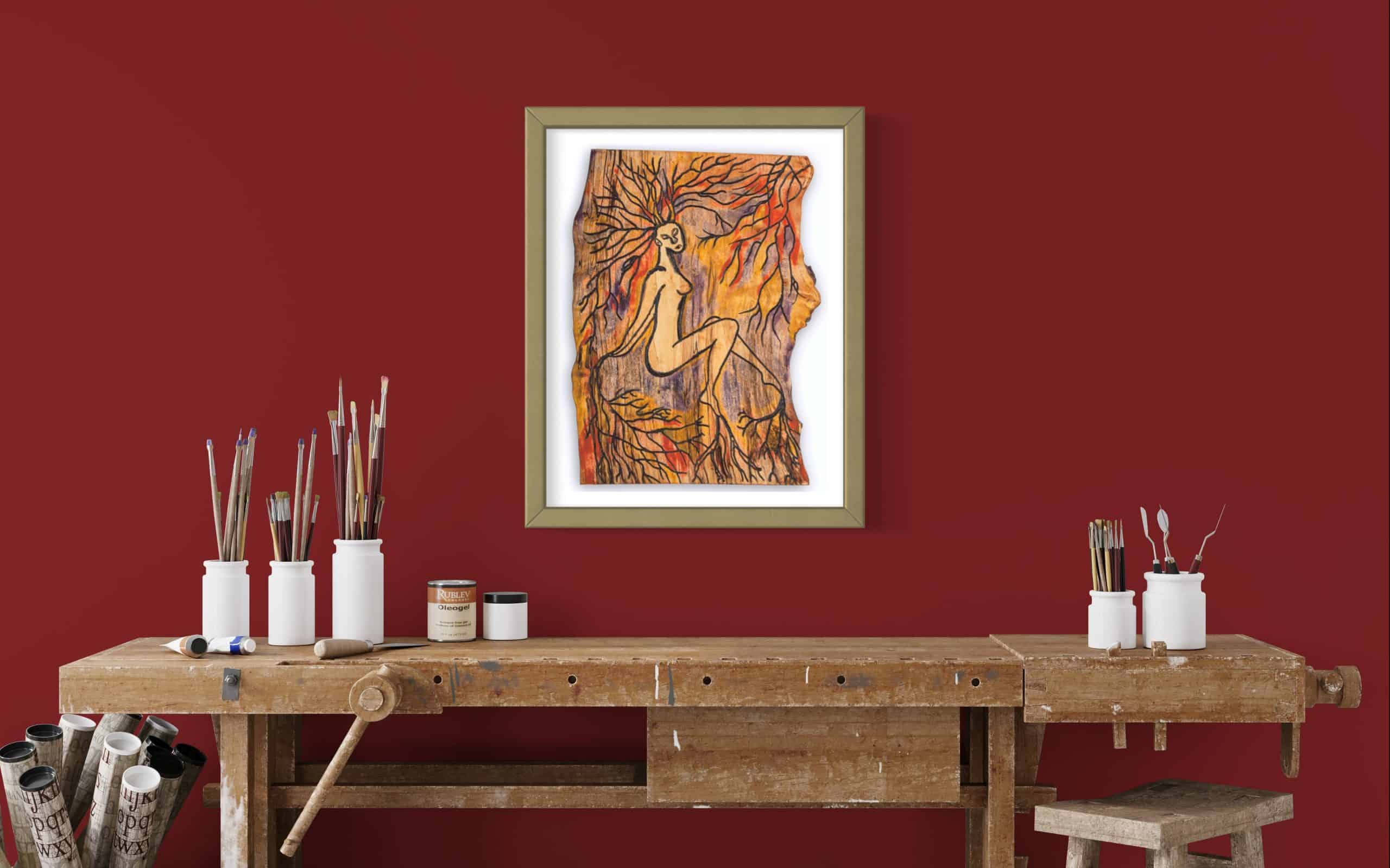 Limited Edition Fine Art Giclee Print - Rooted 4 Close up front on view of this Fine Art Giclee print, limited edition, titled Rooted, illustrated in a olive green frame with a white back on a dark red wall in a room setting, the picture shows a naked female connected to the roots of the forest by her hands, feet and hair