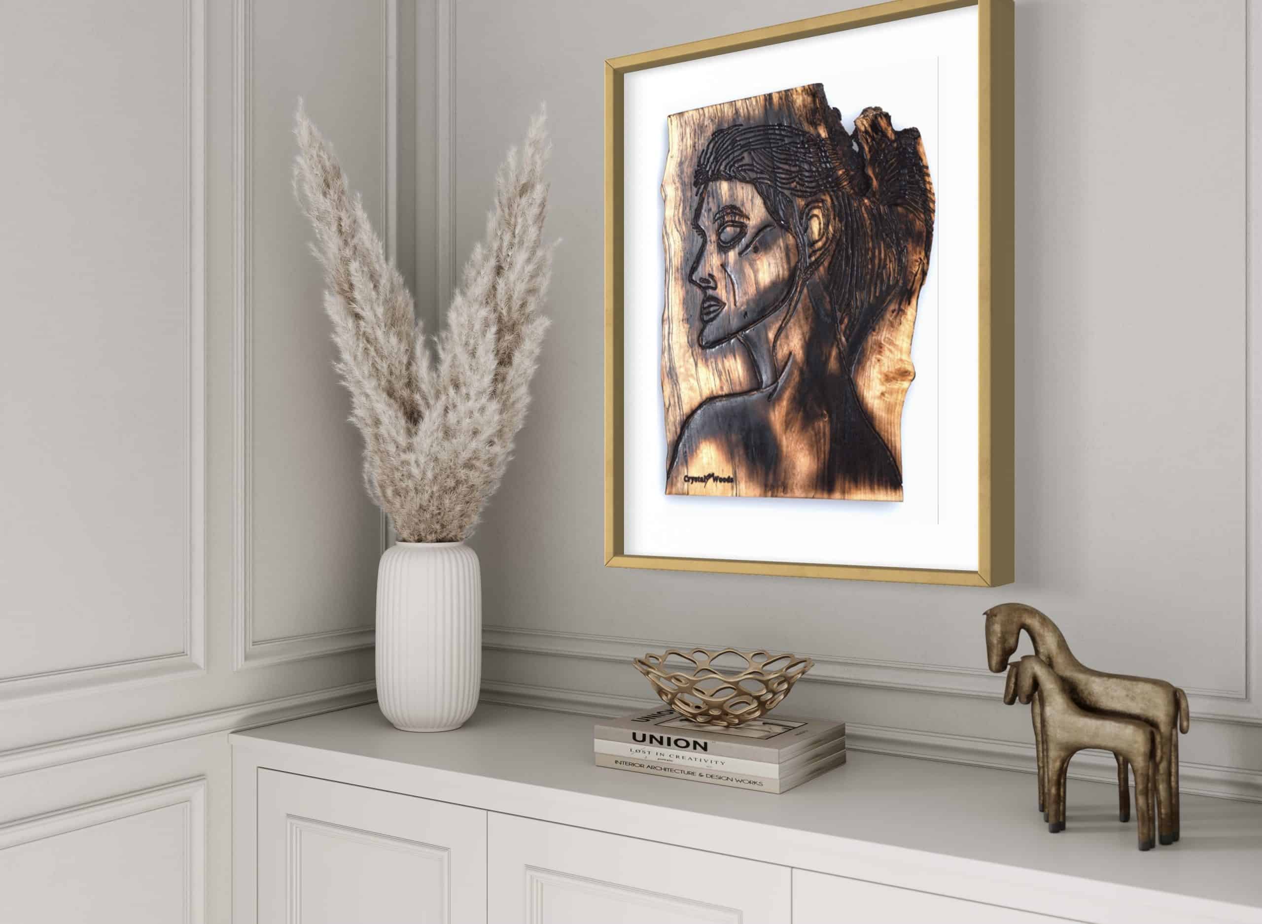 Fine Art Print - Alignment and Composure of a Goddess 3 Close up side angled view of this Fine Art Giclee Print, limited edition of the Original Piece – Alignment and Composure of a Goddess, illustrated in a gold coloured frame with white background set on a pale grey wall with a hallway room setting