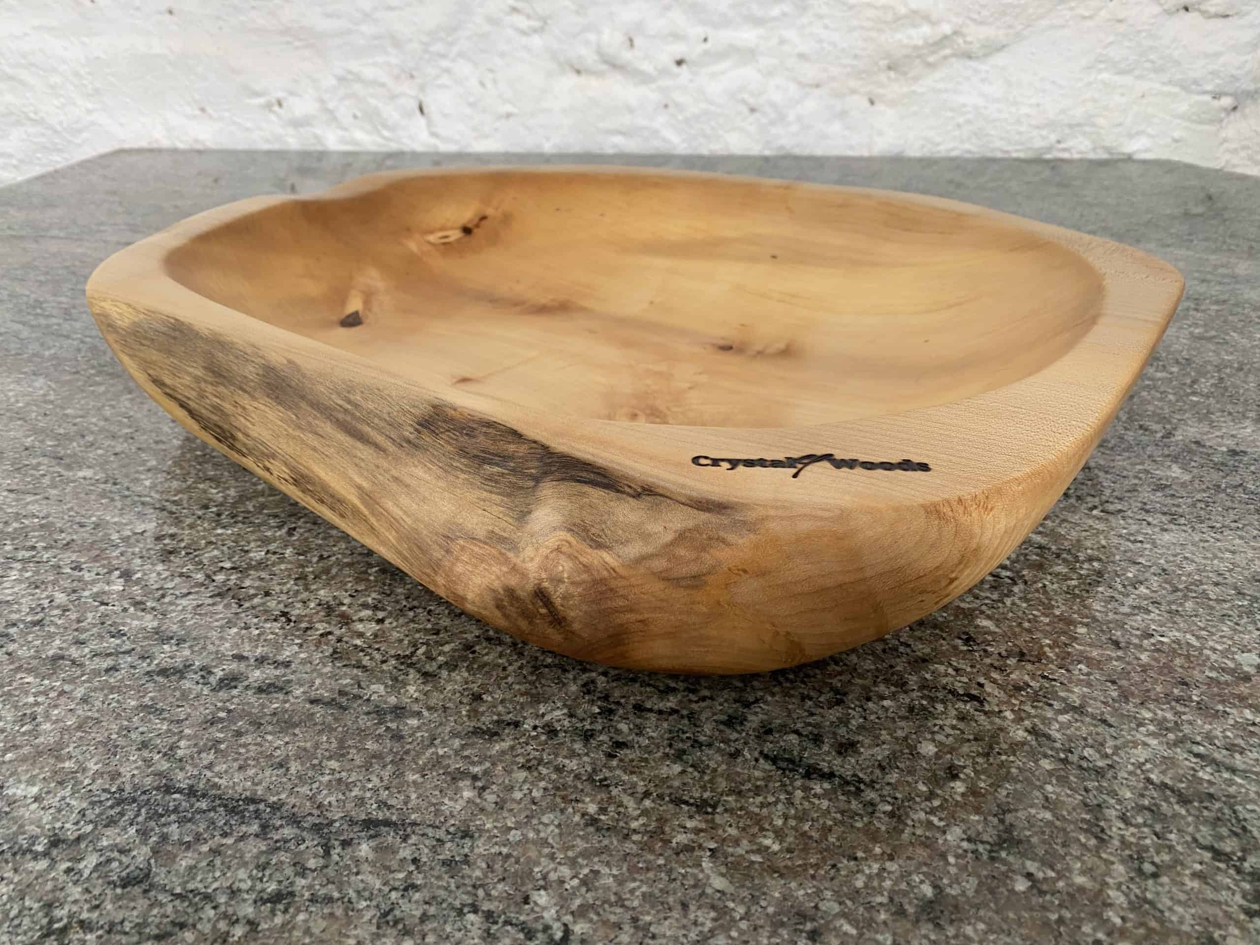 Large Hand Carved Sycamore Salad Bowl 3 Side angled close up view of this Large Sycamore Hand Made Salad Bowl, from locally sourced wood in Devon, produced by Crystal woods and branded with their logo stamp, finished in food safe oil