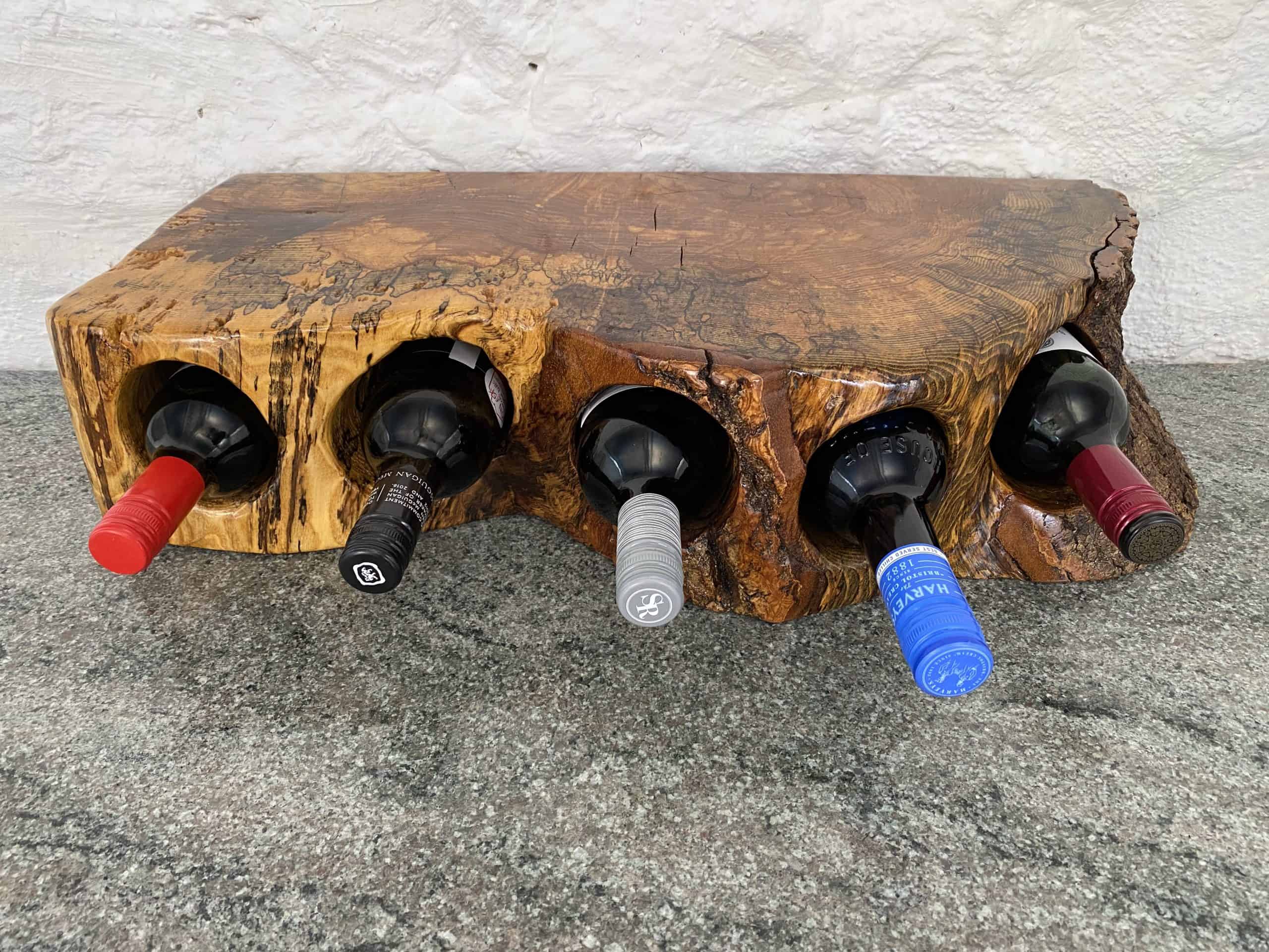 5 Bottle Spalted English Walnut Wine Rack 4 Front on view of this exquisite 5 bottle Spalted English Walnut wine rack displaying five bottles of wine, finished in multiple coats of oil
