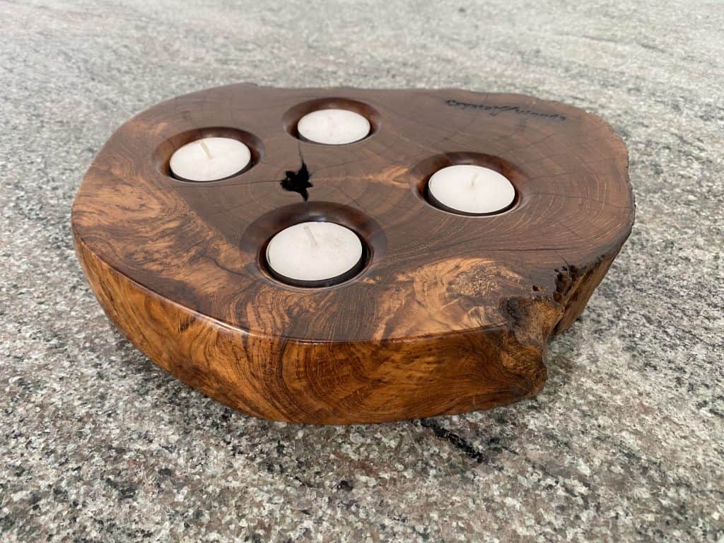 Indonesian Teak Tea Light Holder displaying four candles, finished in multiple coats of oil