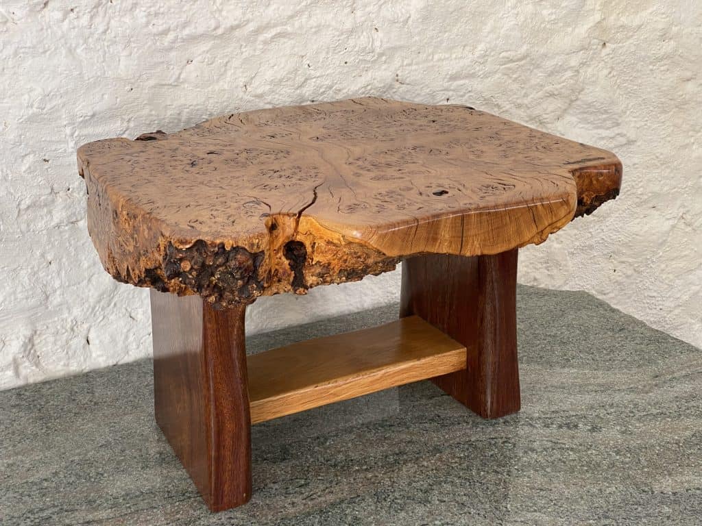 Burr Oak coffee table with Iroko legs finished to a high patina, handcrafted by Crystal Woods