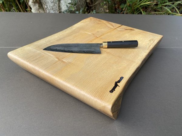 Chucky rolled top English Sycamore butchers block / chopping board from locally sourced timber in Devon, showcasing a hand made Damascus knife