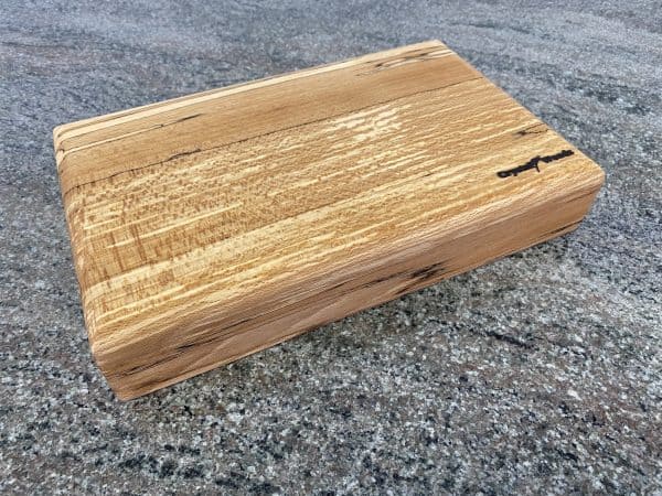 Side view of this Large Round Top English Spalted Beech Chopping Board, handcrafted by Crystal Woods, finished in food safe oil, locally sourced wood in Devon