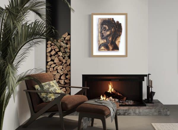 Fine Art Giclee Print, limited edition of the Original Piece – Alignment and Composure of a Goddess, illustrated in a gold wood coloured frame with white background set on a pale grey wall with a room setting, above a fire place