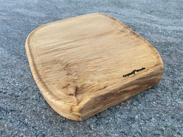 Close up view of this Sycamore Horseshoe Chopping Board, handcrafted by Crystal Woods, finished in food safe oil, branded with their logo stamp