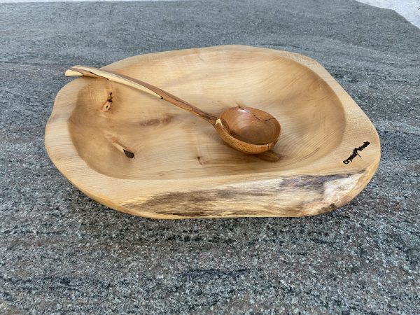 A Large Sycamore Hand Made Salad Bowl, showing a handmade ladle from spalted Beech for decoration, locally sourced wood in Devon, produced by Crystal woods, finished in food safe oil