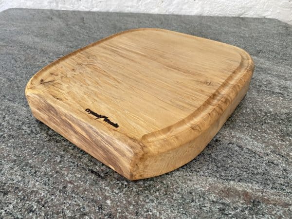 Close up view of this Sycamore Horseshoe Chopping Board, handcrafted by Crystal Woods, finished in food safe oil