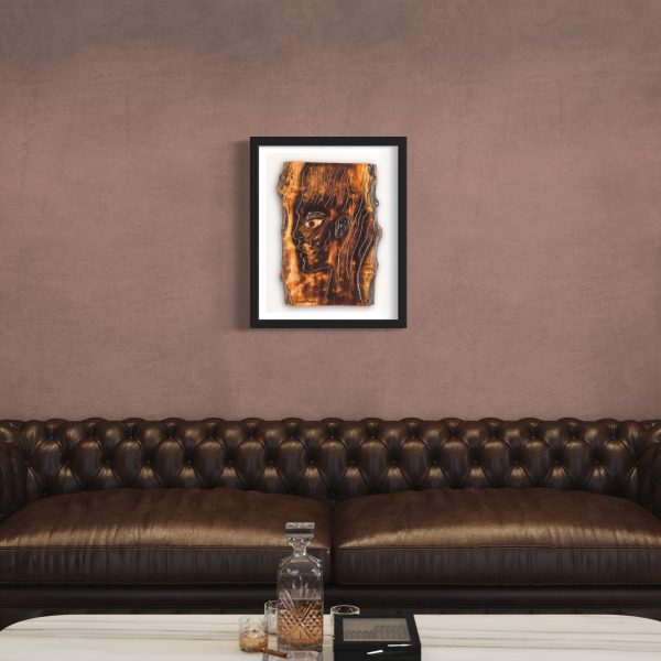 Fine Art Giclee Print of the Original Piece – The Energy Inside Me, a picture of a mans head illustrating the eternal flame of spirituality and the energy that resides within us all, shown in a black frame and a white background set on a pale bronze colour wall above a contemporary leather chesterfield style sofa