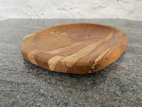 Close up angled view of this Large Spalted Beech Food Platter, finished in food safe oil, from locally sourced wood in Devon, handcrafted by Crystal Woods and branded with their logo stamp