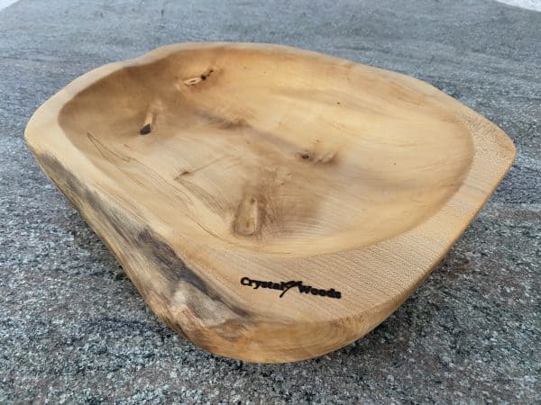 Close up view of A Large Sycamore Hand Made Salad Bowl, from locally sourced wood in Devon, produced by Crystal woods and branded with their logo stamp, finished in food safe oil