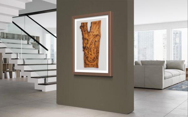 Fine Art Giclee Print of the Original Piece – Mania’s Connectedness, a limited edition run of 100, the picture shows a naked lady illustrating the profound essence of human form in tranquil contemplation and unshakable serenity. Set in a chunky copper colour frame with a white and grey background, set on a dark olive green wall in a New York style apartment