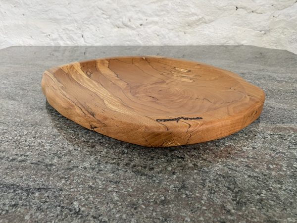 Close up angled view of this Large Spalted Beech Food Platter, finished in food safe oil, from locally sourced wood in Devon, handcrafted by Crystal Woods and branded with their logo stamp