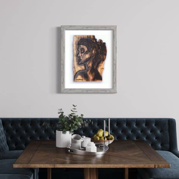 Fine Art Giclee Print, limited edition of the Original Piece – Alignment and Composure of a Goddess, illustrated in a grey wood coloured frame with white background set on a pale grey wall in a dining room above a blue velvet corner sofa and dark wood table