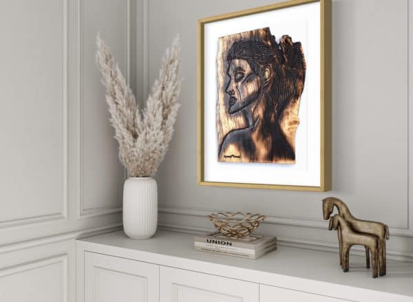 Close up side angled view of this Fine Art Giclee Print, limited edition of the Original Piece – Alignment and Composure of a Goddess, illustrated in a gold coloured frame with white background set on a pale grey wall with a hallway room setting