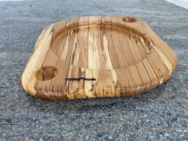 Close up view of this unique English Spalted Beech food sharing platter with Two spherical dip holes, finished in multiple coats of food safe oil, hand made by Crystal Woods and branded with their logo stamp