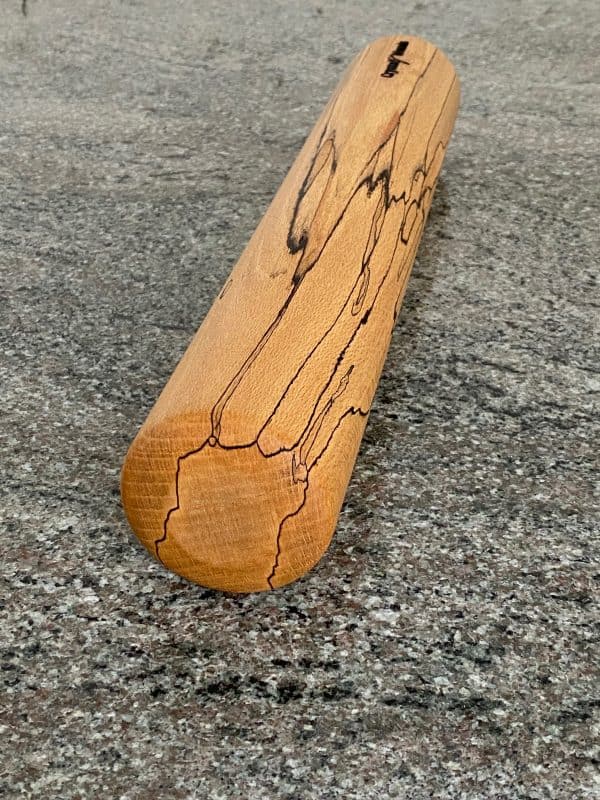 Close up end view of this contemporary Spalted Beech rolling pin, finished in food safe oil, hand turned by Crystal Woods