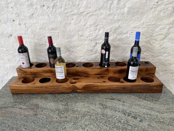 Mini bar / wine rack from reclaimed French Oak displaying bottles of wine