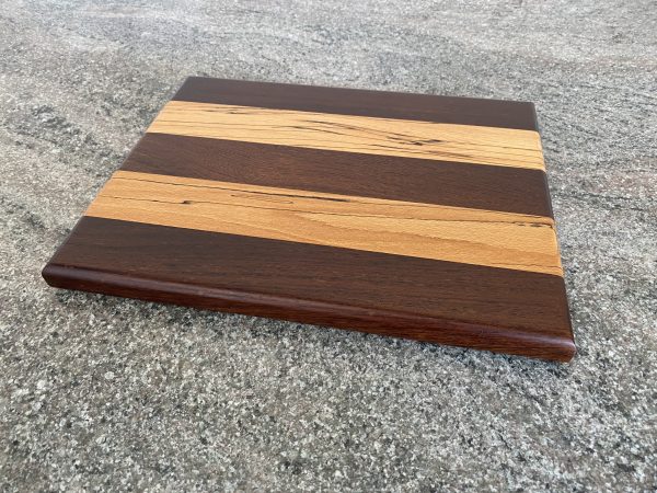 sleek and slender two tone cutting board in African Panga Panga wood and English Spalted Beech