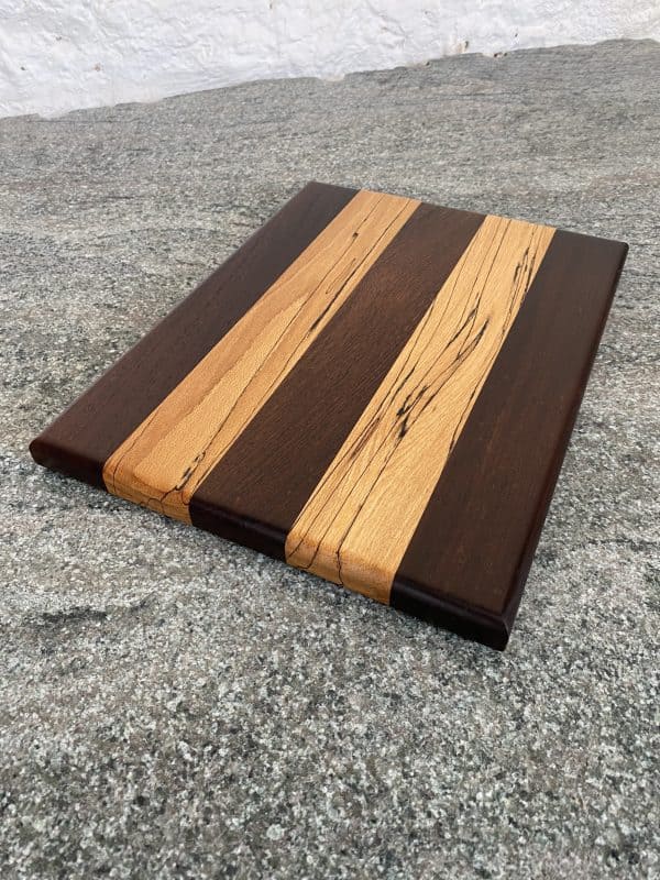 over head view of African Panga Panga and English Spalted Beech thin and slender chopping board