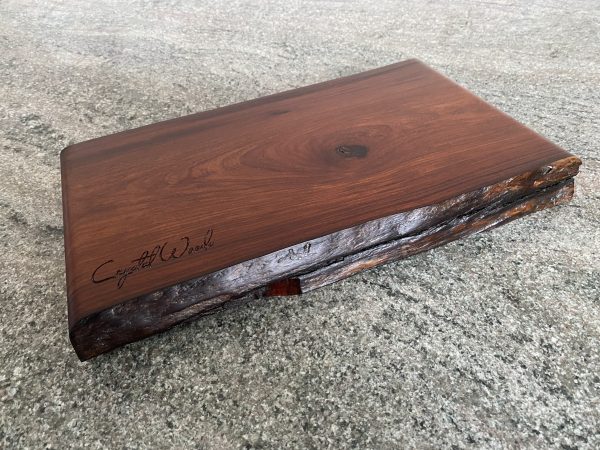 Wood chopping board with live edge detail, finished in food safe oil