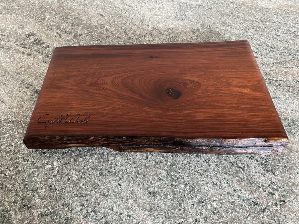 Live edge African Pau Rosa chopping board, handcrafted by Crystal Woods